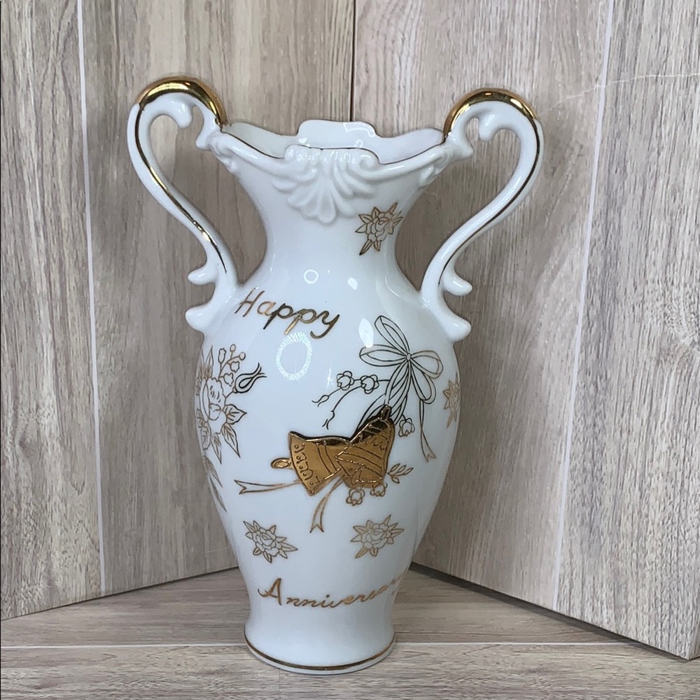 Elegant White and Gold Vase with Purple Flowers